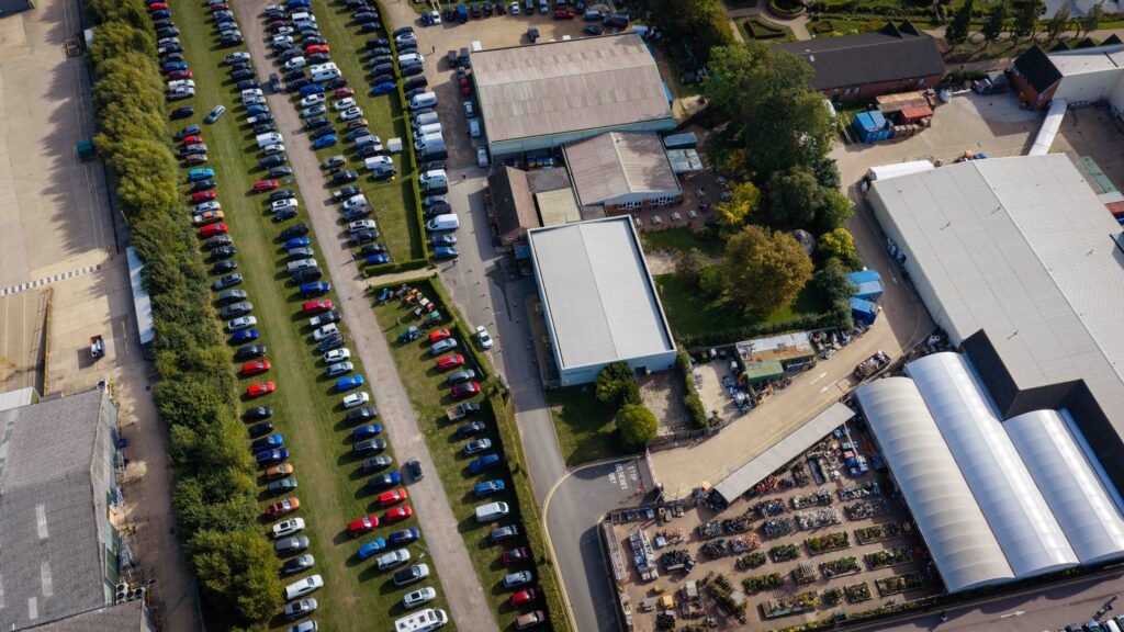 Cars filling the visitor car park at Springfields on Spalding Model Tractor Show day, seen from above