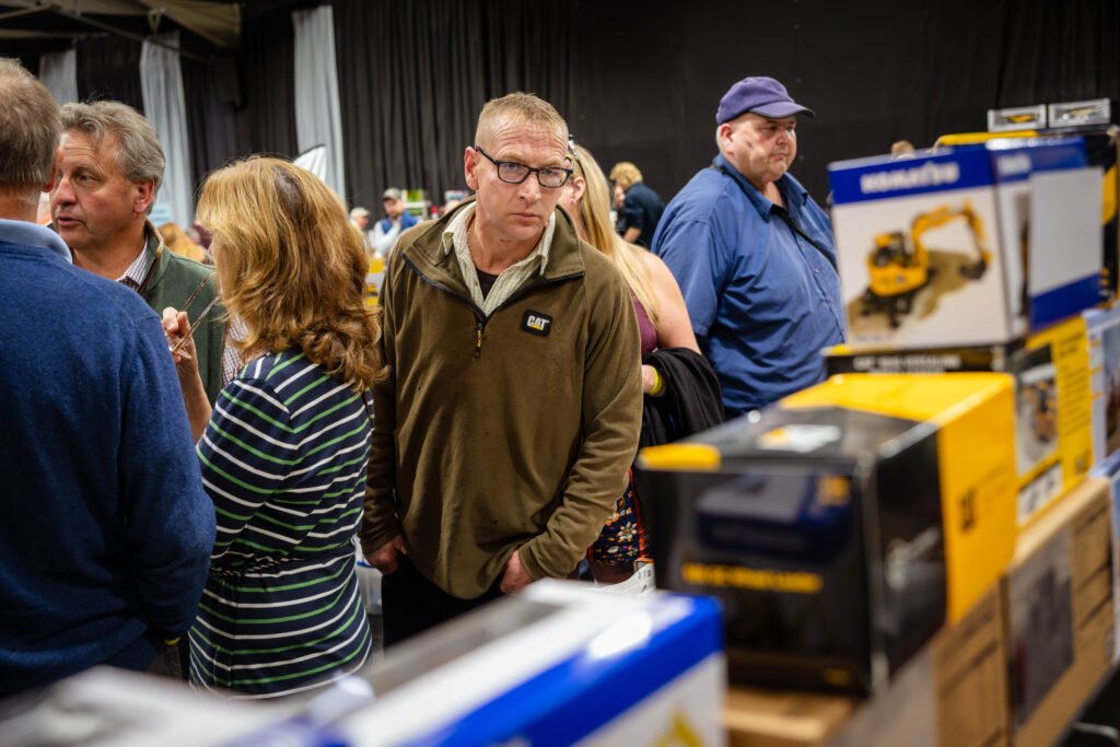 Collectors browsing boxed construction models at the Spalding Model Tractor Show