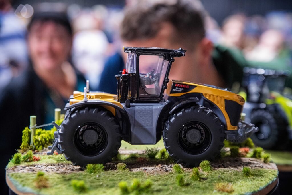 A model JCB Fastrac tractor displayed on a diorama